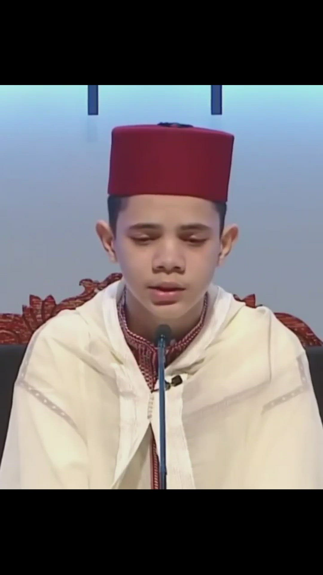 'Video thumbnail for Kid reciting Quran beautifully with a red hat'