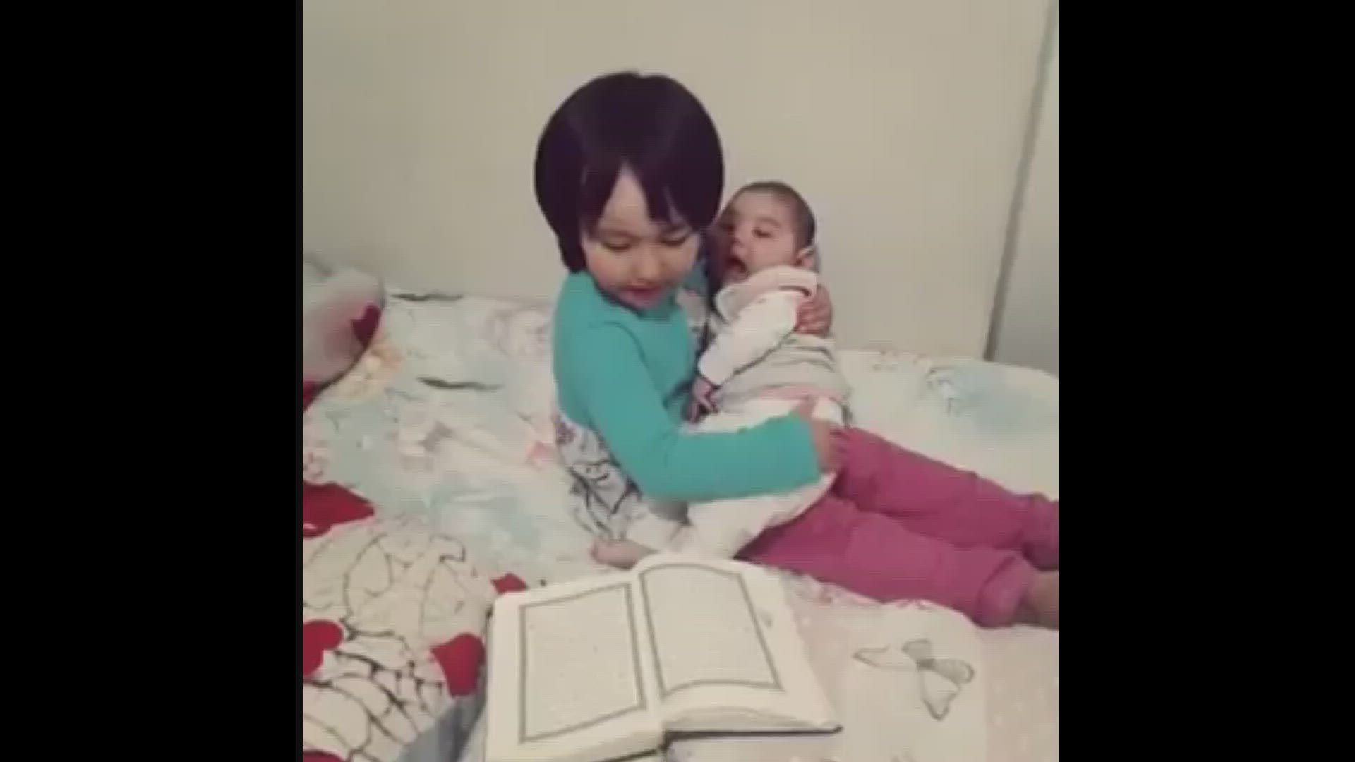 'Video thumbnail for Baby girl putting her brother to sleep with Tilawat in a peaceful nighttime routine'