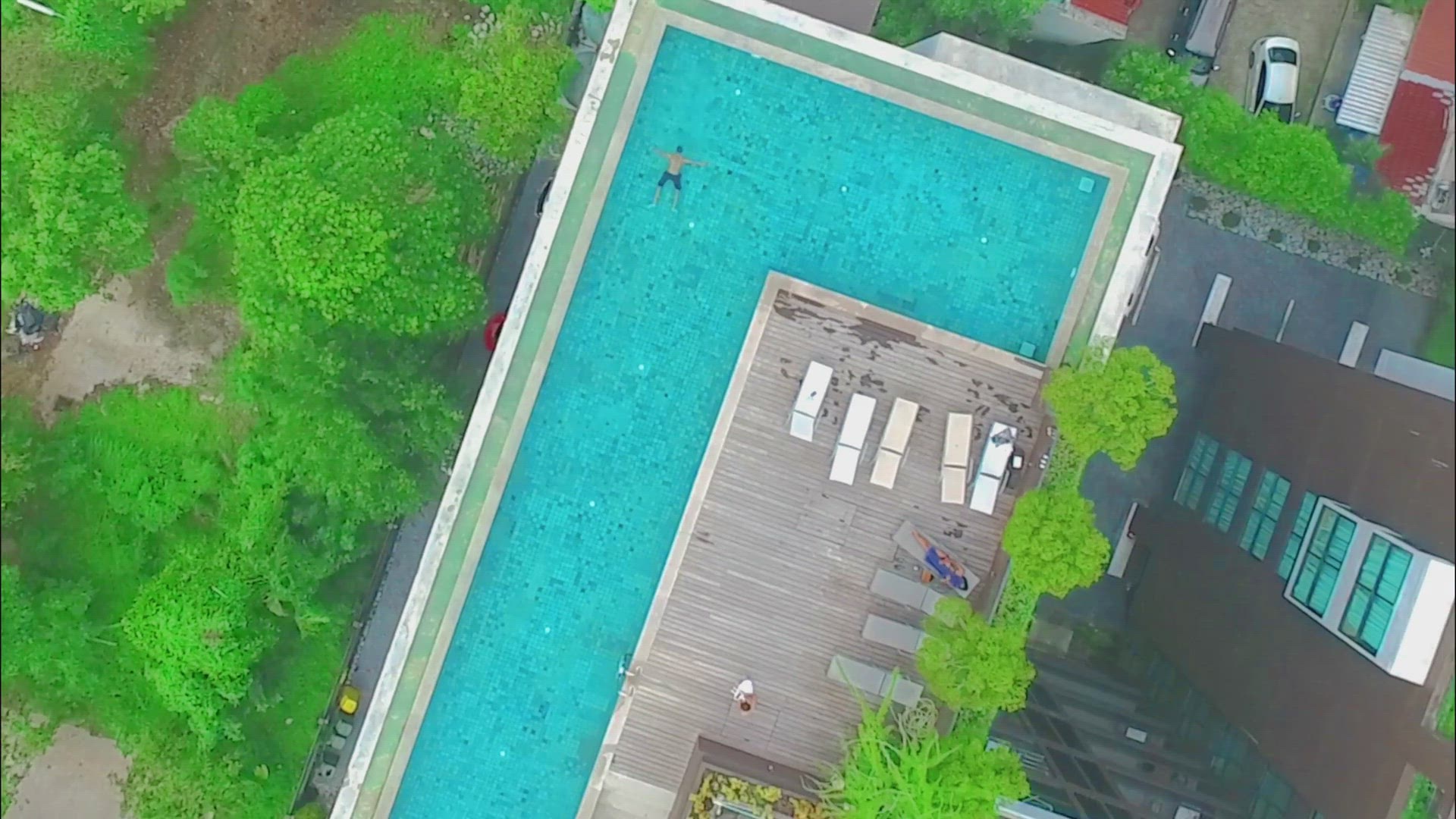 Video thumbnail for Drone shot from Man swimming in a Large Pool