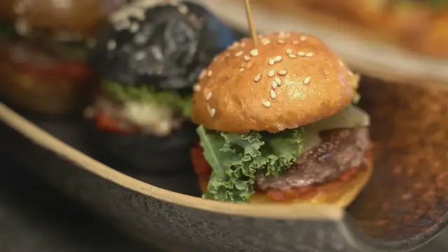 'Video thumbnail for Close up of Mini Hamburgers Made from Different Colors and Ingredients'