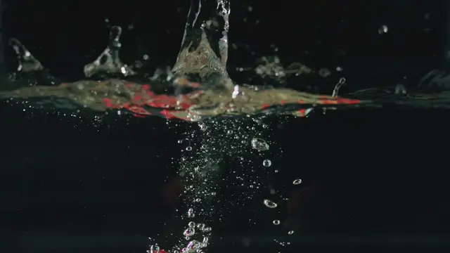 'Video thumbnail for Strawberries falling in Water Filmed from Under Water Close Up'
