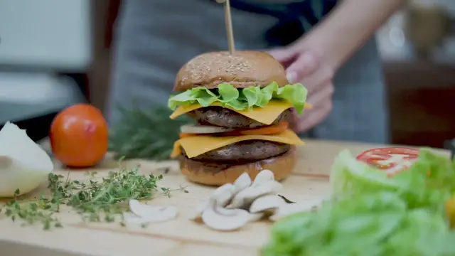 'Video thumbnail for Freshly made Hamburger the Chef Puts Stick Through the Hamburger To Serve it'