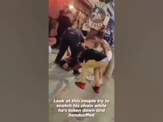 'Video thumbnail for Black couple tries to rob a man for his chain while he's in handcuffs being arrested.'