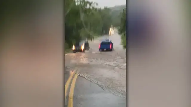 'Video thumbnail for Couple Drive Into Flood To Rescue Trapped Dog And Man | Wild-ish TV'