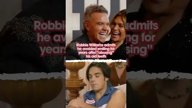 'Video thumbnail for Robbie Williams admits he avoided smiling for years after “abusing” his old teeth'