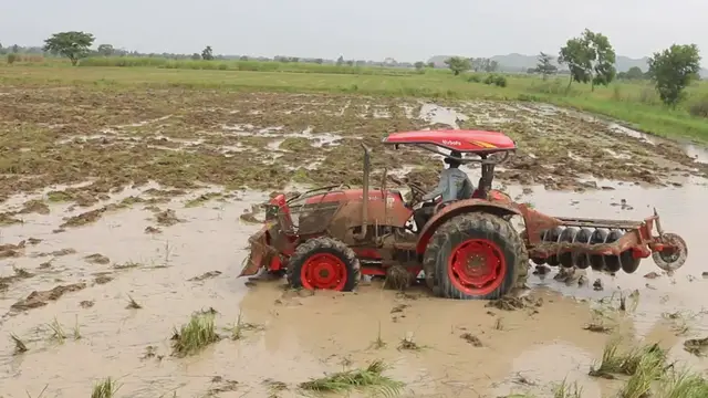 'Video thumbnail for Famer drive tractor to plough soil in fiedl'