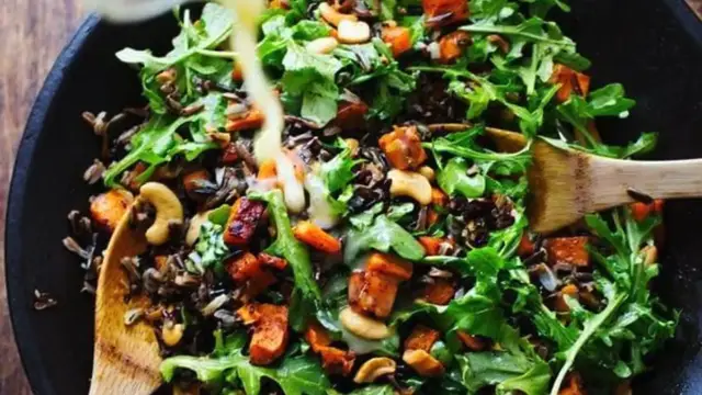 'Video thumbnail for Roasted Sweet Potato, Wild Rice, and Arugula Salad recipe'