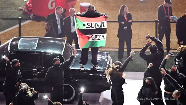 'Video thumbnail for Super Bowl performer who waved ‘Sudan and Free Gaza’ flag at halftime arrested'