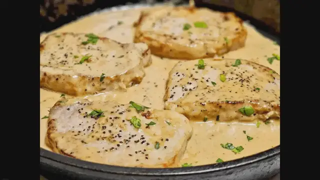'Video thumbnail for Smothered Boneless Pork Chops In Creamy Garlic Sauce'