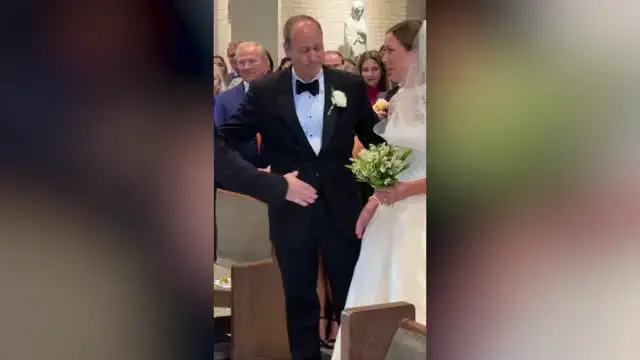 'Video thumbnail for Groom’s Nervous Handshake With Wife-To-Be At Altar Leaves Bride Laughing'