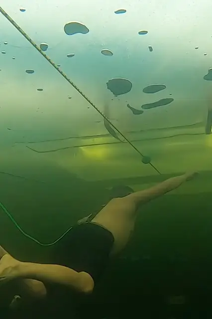 'Video thumbnail for Ice swimmer travels under sheet in cold plunge'