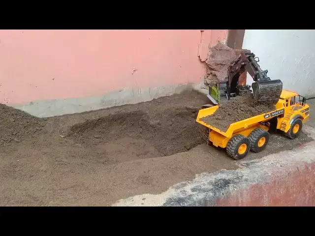 'Video thumbnail for RC Excavator CAT and RC Truck Volvo A40G Work | BangSiagianID'