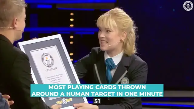 'Video thumbnail for Most playing cards thrown round a human target in one minute - Guinness World Records'