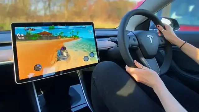'Video thumbnail for Tesla Model 3 Racing game competition w/ my girlfriend!'