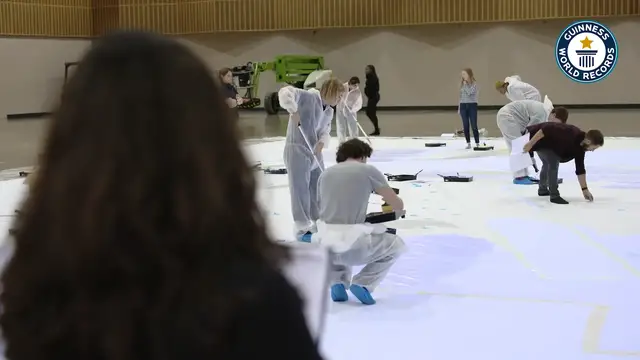 'Video thumbnail for Illuminating Mental Health, World's Largest Blacklight Painting for Charity'