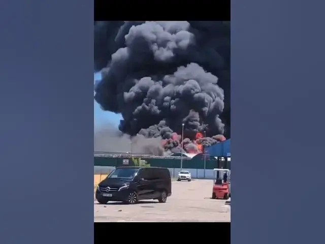'Video thumbnail for Shocking moment warehouse explodes in Spain sending workers running and black smoke into space'