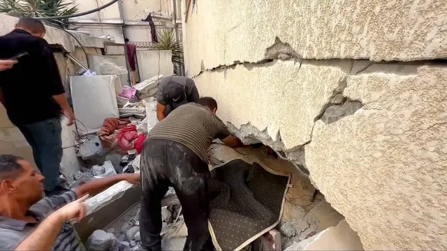 'Video thumbnail for Israeli strikes flatten homes in Gaza City as rescuers dig through rubble with their bare hands'