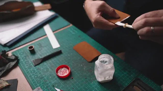 'Video thumbnail for Someone glueing leather parts'