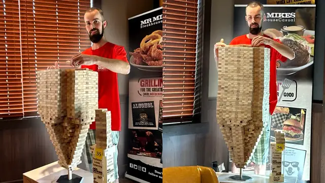 'Video thumbnail for Abbetjes Meindert de Boer: Most Jenga Blocks Stacked on One Vertical Block'
