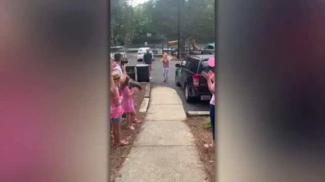'Video thumbnail for Woman Surprised With Guard Of Honor At 'No Mo Chemo' Parade | Happily TV'