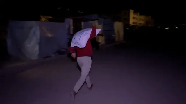 'Video thumbnail for Palestinians in Gaza unload flour as limited aid finally arrives'