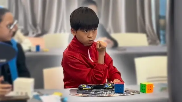 'Video thumbnail for 11-year-old sets fastest average time to solve a 3x3x3 cube'
