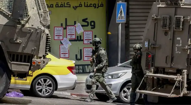 'Video thumbnail for Israeli forces raid West Bank exchange shops, kill 1 Palestinian, wound 30 in Nablus assault'