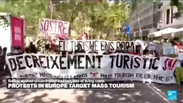 'Video thumbnail for Spaniards turn water guns on visitors in Barcelona and Mallorca to protest mass tourism'