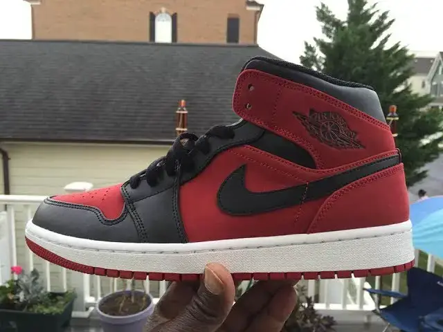 'Video thumbnail for Quick Look At The Air Jordan 1 Mid Banned Black Red- Buy It Now'